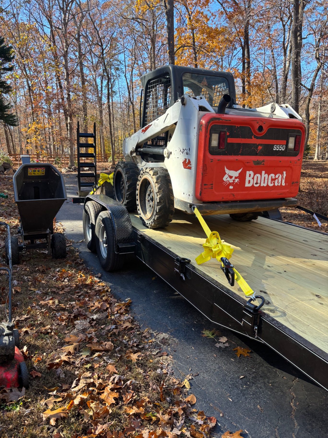 Grizzly Bobcat S550 loaded on trailer with chipper
